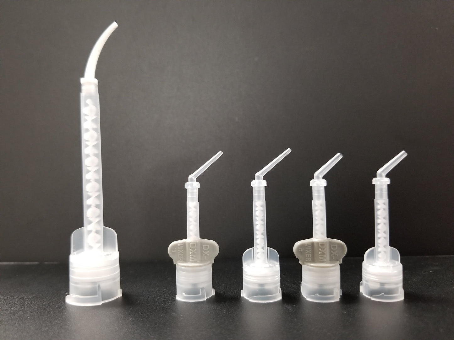 Intra oral tips attached to their respective mixing tips. 