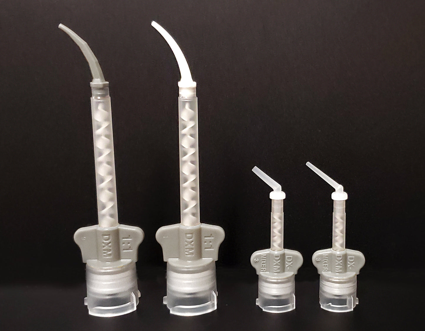 Light body intra oral tips white and gray on light body mixing tips. Endo and core intra oral tips also attached to core buildup mixing tip. 