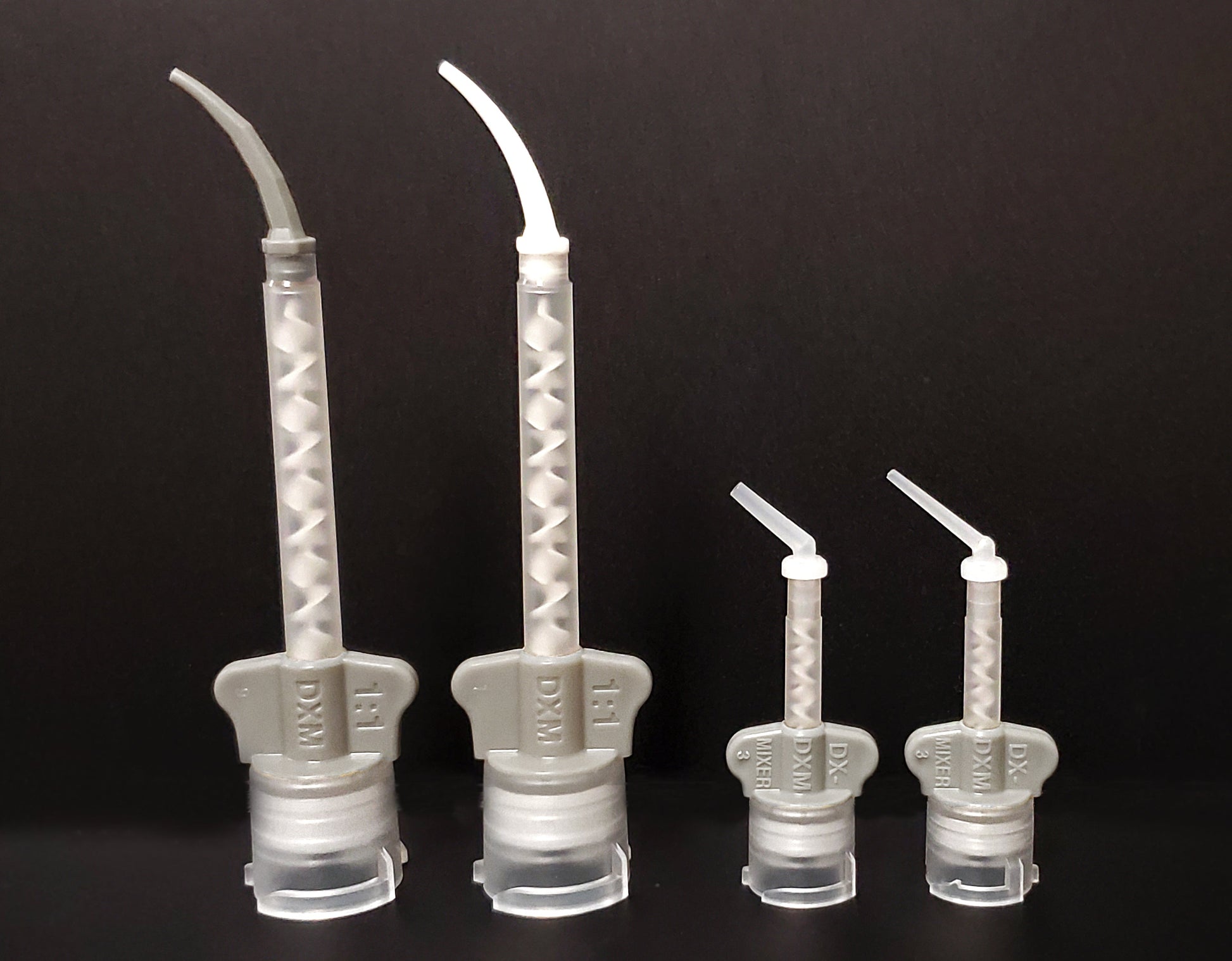 Light body intra oral tips white and gray on light body mixing tips. Endo and core intra oral tips also attached to core buildup mixing tip. 